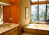 Upstairs Master Bathroom.  Light some candles, pour a glass of your favorite wine and enjoy a luxurious bath.  There is also a sauna in this master bath.