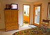 Another view of Master bedroom with queen bed and TV