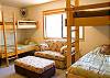 The 3rd bedroom downstairs features two sets of built in Bunk Beds, a TV, and a CD Player. This bedroom shares a hall bathroom.