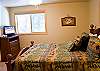 Another view of Queen Master Bedroom that is upstairs with flat screen TV.