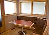 Great place for breakfast and talk with the chef as it is right off the kitchen.  Also there is a door to the wrap around deck.