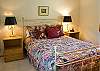 Downstairs Master Queen Bedroom.  Includes a TV and spacious closet storage.