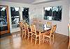 Upstairs Dining Room.  Enjoy a fabulous meal in this dining room which opens to the kitchen and living room.  Seats 8 with 3 seats at the breakfast bar.