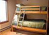 This upstairs bedroom has a set of Pyramid Bunks.