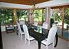 The dining room has windows that look out to the deck and the lake beyond.  The dining table seats 8 with room for more.