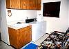 The laundry room also contains a full futon.  The half bath is around the corner.