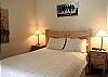 Queen Bedroom is accented with pine furniture.