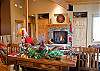 Comfortable living room with plenty of seating and around the fireplace.