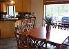 The open floor plan allows conversation from the kitchen to the dining room.