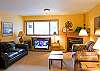 Down stairs family room with comfy couches , TV and gas fireplace to snuggle up too.