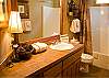 Shared hall bath with twin and queen bedrooms