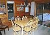 The kitchen and dining room connect to make serving and eating meals a breeze. Lots of windows will make your dining a pleasant and bright experience during your vacation.