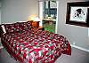 This queen bedroom is downstairs and is light and bright.