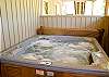 The hot tub is on the lower deck and very private.  It is just waiting for you to step in, sit down and relax.