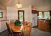 Dining room seats eight with extra seating at breakfast bar.