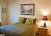 Queen Bedroom downstairs has ample lighting for reading a good book.
