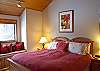 Upstairs King Master Bedroom with master bathroom and a jacuzzi tub. Also has a  wall mounted TV.