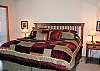 Comfy King bed with snuggly linens. Door leads directly to private hot tub and deck. Wonderful spot for starry nights.