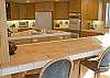 A convenient breakfast bar will be a place the family will want to gather for coffee or cocoa in the morning while mom frys up the bacon!