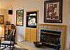 A warm wood fire provides a great environment for the whole family to stay in and watch one of the many movies provided in this home.