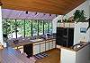 Kitchen is fullly equipped, gas stove, 2 ovens, ice maker and lots of space.  Also features a bar with stools, overlooks the dining room table, and has plenty of light.
