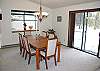 A stylish wood dining set provides the perfect backdrop for special meals and memories in Sunriver.