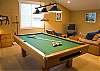 Great room above the garage. This is the perfect place to send  your children. It has a pool table, TV, board games, ect. This truly is a dream home for a vacation.