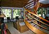 Living room with wrap around staircase. Has a wood fireplace, house is right on the river.