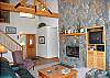 Enjoy the fire and the game at the same time from this comfortable space!  You'll love the high valuted ceilings!
