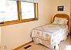 The second upstairs bedroom is perfect for the kids!  A Queen Size Bed and a Twin Size Bed are featured in this room.  It shares the double bath.