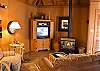 Cozy furniture and a warm fireplace will invite you to stay indoors for some good conversation.