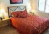 Queen Bedroom just off the great room and shares a jack and jill bathroom with the king bedroom.