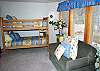 The kids will really enjoy this light and beautifully decorated 2 bunk bedroom with a love seat, TV/DVD/VHS.    You can see part of the hot tub outside this room.