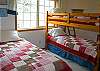 Downstairs Room with one set of bunk plus a twin bed and trundle.
