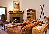 Lavishly decorated, this living room is the perfect place to relax! Indulge in oversized furniture, a gas fireplace, and a good book!