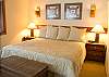 Enjoy a good nights rest. This King Master Bedroom has a walk in closet and does have a TV.  There is also access to the deck and hot tub from this room.