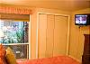 The bedroom has a wall mounted television.
