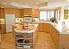 Large open kitchen makes cooking family meals a delight.  Well organized and fully stocked.  This large kitchen island will surely invite the small ones to help.