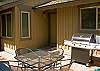 The courtyard has a propane barbeque and seating for four.