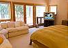 This huge upstairs King Master Suite has french doors and access to the upstairs deck. Large Master Bathroom with double large sinks, private toliet &amp; large jacuzzi tub.