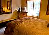 A full bath is accessible from either this queen bedroom or the third bedroom with the two Twins. You will enjoy the cozy and comfortable lodge decor throughout this home.