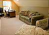 Upstairs Loft with Queen Sofa Sleeper, chair and TV.