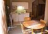 Small kitchen and dining area in upstairs separate unit.