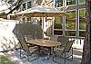Relax on the back patio with family and friends.