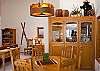 A round dining set and bar seating create ample space for the entire family during mealtimes in this charming home!