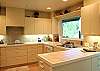 Nice bright and open kitchen with plenty of cupboard space.