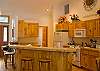 This large kitchen is equipped with all the comforts of home.  Also extra seating at the bar!
