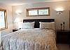 This master bedroom features a Queen Size Bed, master bathroom, walk-in closet, and TV.