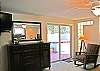There is a flat screen tv and access to the hot tub from this Master Suite.