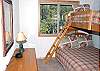 This is one of two pyramid bunk rooms upstairs that share a hall bath.